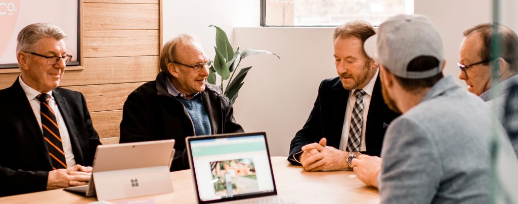 4one4 Property Co | Leading Real Estate Companies of the World (LeadingRE) | Chris McGregor & the Sales Team in a meeting at 4one4 Property Co.