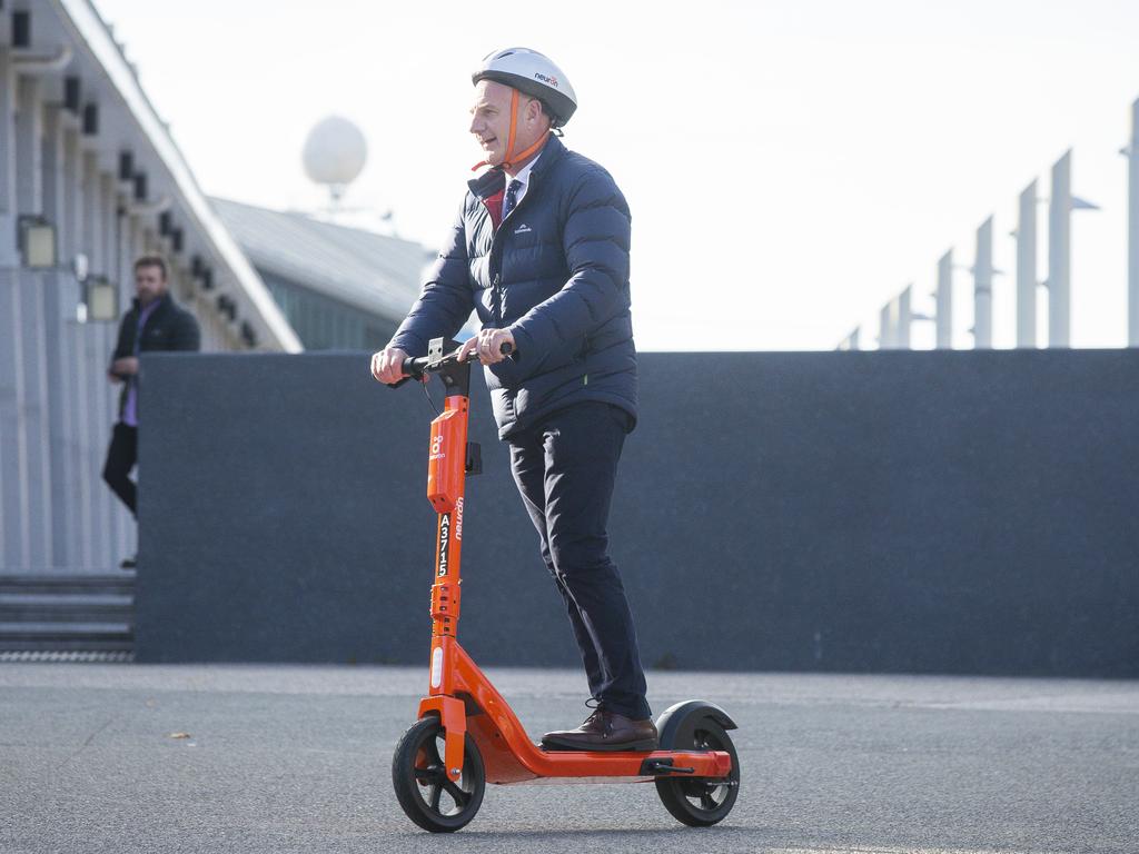4one4 Property Co | E-scooter Trial | Tasmanian Premier, Peter Gutwein, rides electric scooter to a press conference regarding a trial of e-scooters. 
Picture: NCA NewsWire / Richard Jupe