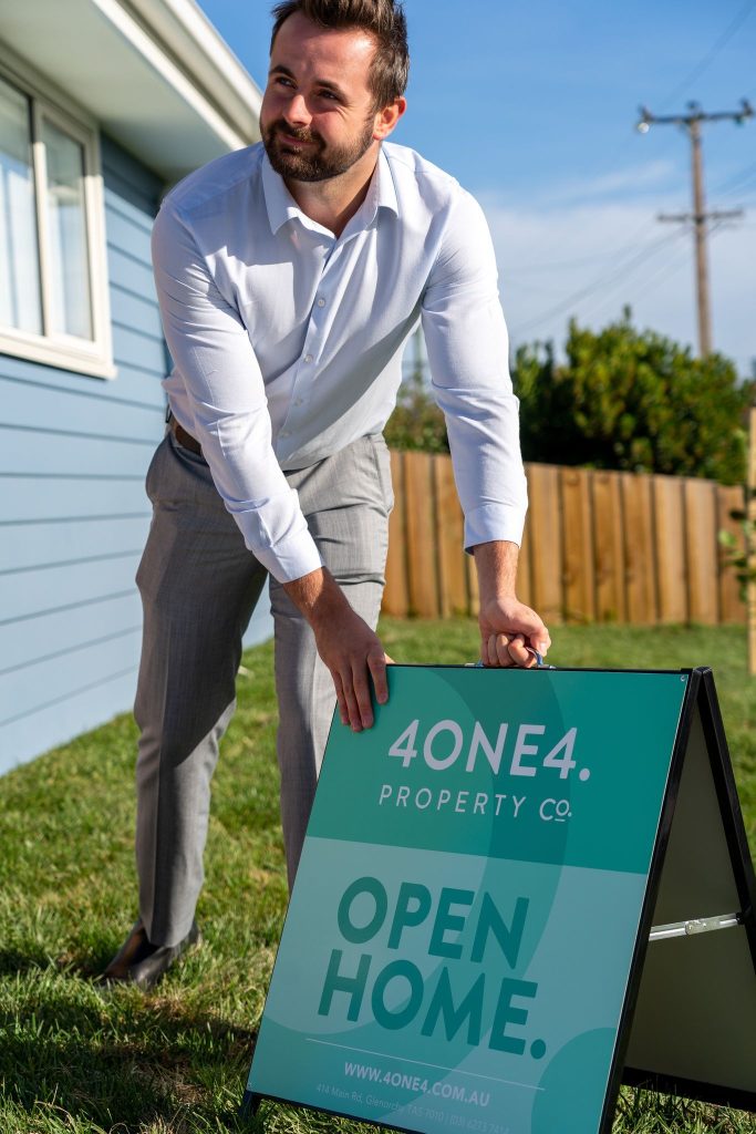 4one4 Property Co | Open Home Tips for First Home Buyers | 4one4 Sales Consultant, Aaron Murray, getting ready for his Open Home event